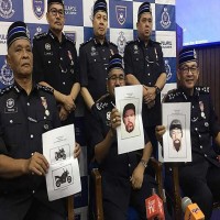 شرطة ماليزيا تكشف صور المشتبه باغتيالهما فلسطينيا في كوالالمبور